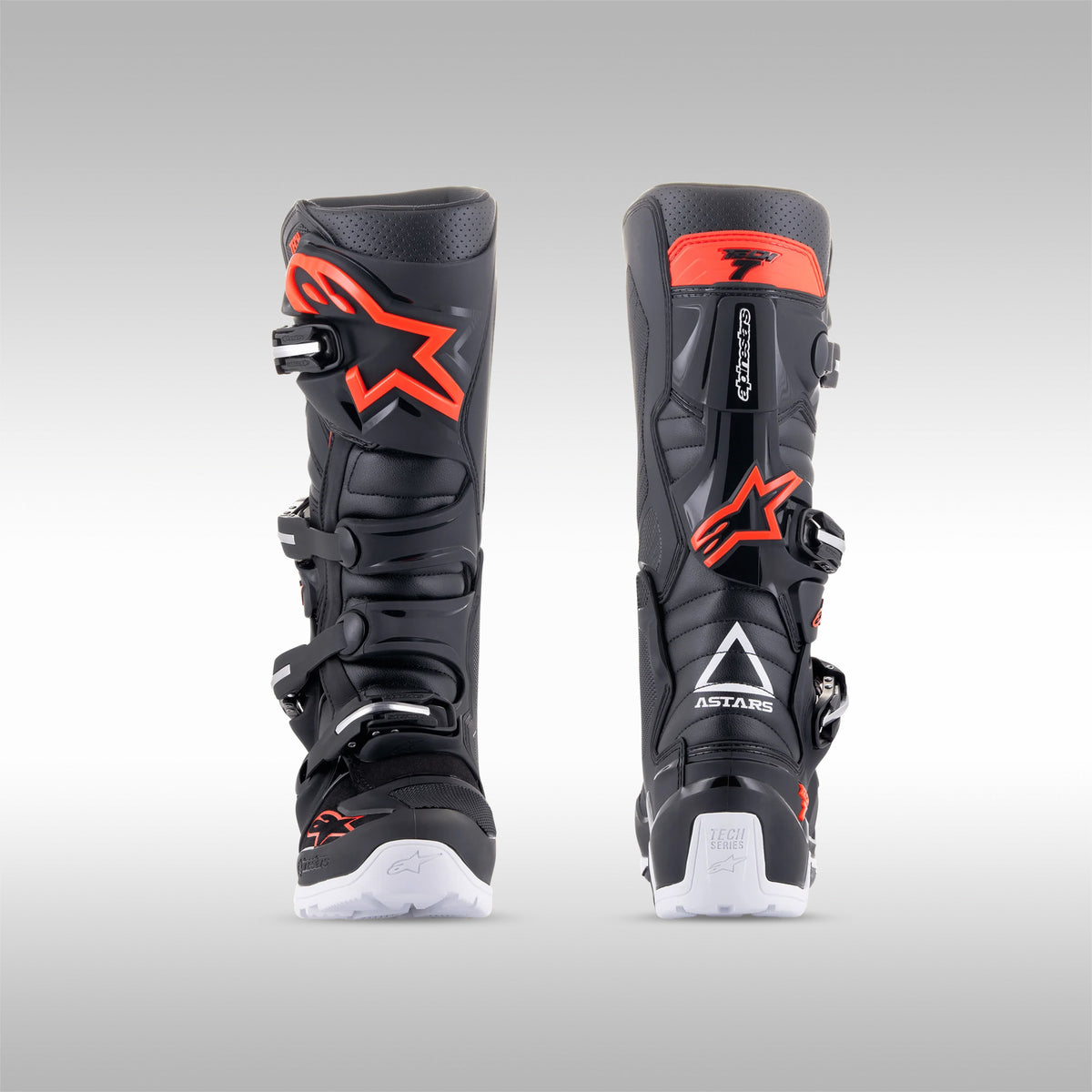 Alpinestars Tech 7 Enduro boots in the Light Gray, Dark Gray with Bright Red accent option. View of the left and right boot next to each other directly from the rear. Enduro and dualsport motorcycle boots. Protective gear for dirtbike riding.