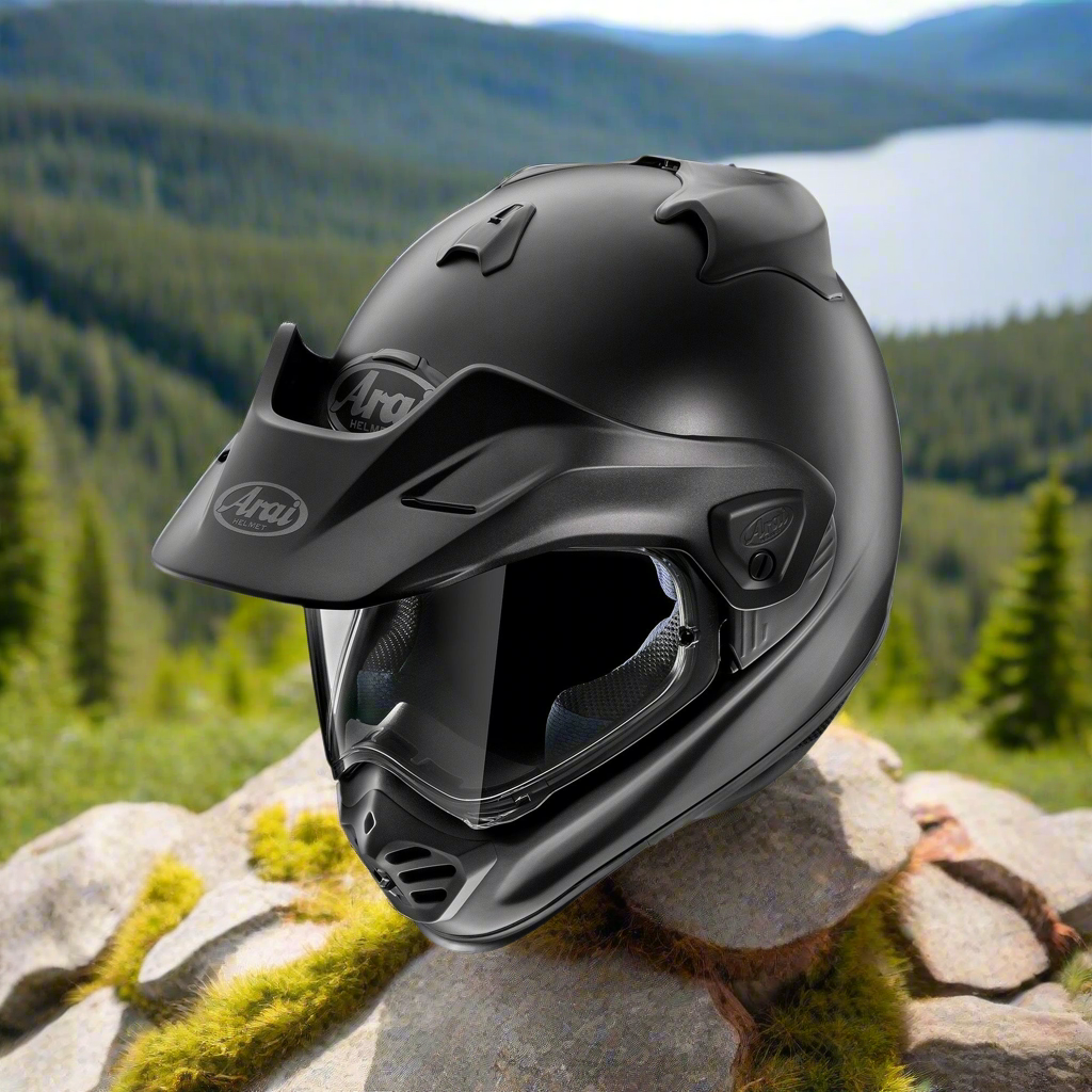 Arai XD-5 Adventure motorcycle helmet in black frost on a mountain ridge with a lake in the background.