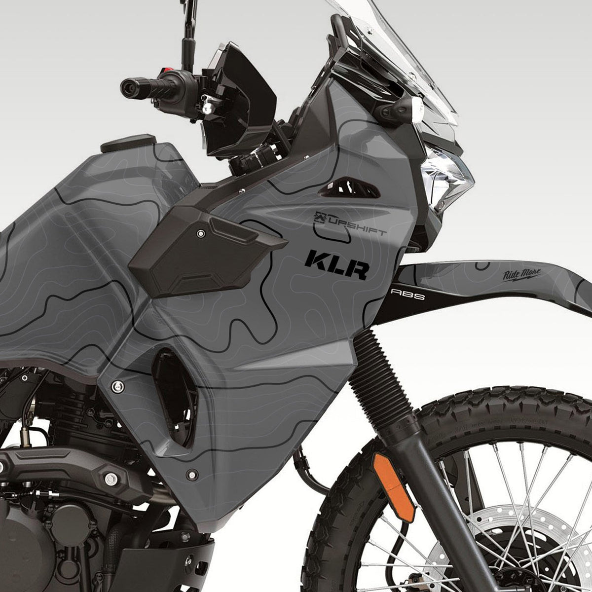 2022 + Kawasaki KLR650 side view of the front half. Topo graphics kit in matter gray. Topo lines are gray and black. Aftermarket motorcycle wrap or graphics kit.