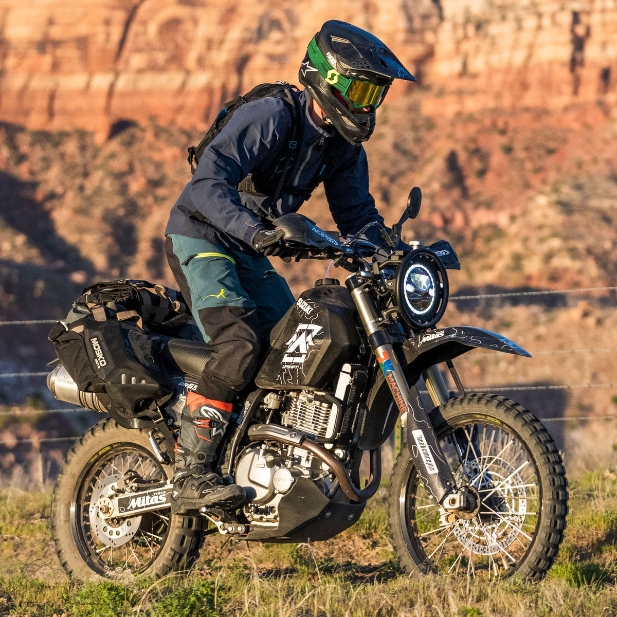 Upshift Online&#39;s 2022 DR650 project bike in the mountains. Shown with accessories from TMBR MOTO like the Acerbis skid plate, Doubletake Mirrors, Seat Concepts seat and of course and Acerbis 5.3 gallon fuel tank.